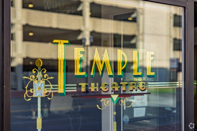 Ornate lettering decorates the windows to the Temple Theatre Orchestra near Northeast.