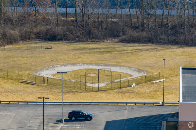 Clinton Elementary School features a large athletics area behind the school for student programs.