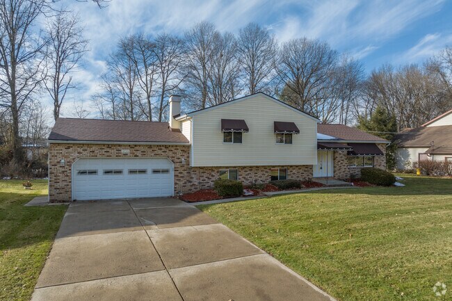 Many lots in Churchill are split-level homes featuring towering trees and wide front lawns.