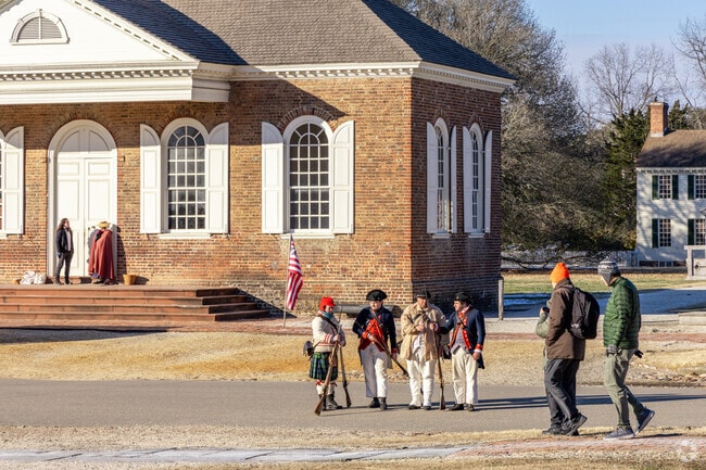 Colonial Williamsburg interpreters perform at outdoor exhibits along Duke of Gloucester St.