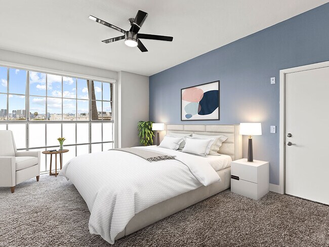Bedroom with gorgeous window view and ceiling fan.