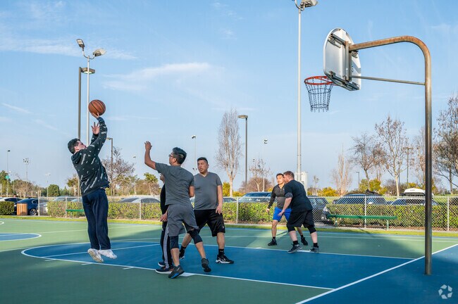 Star View residents enjoy pickup games at Fountain Valley Sports Park’s basketball courts.