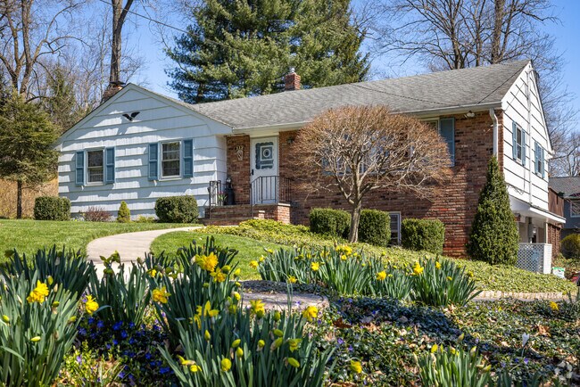 Spring bulbs emerge gasping for sunshine outside of this split-level home in Watchung, NJ.