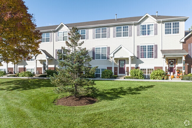 Landscaping and snow removal are included amenities in Remington Trails townhomes.