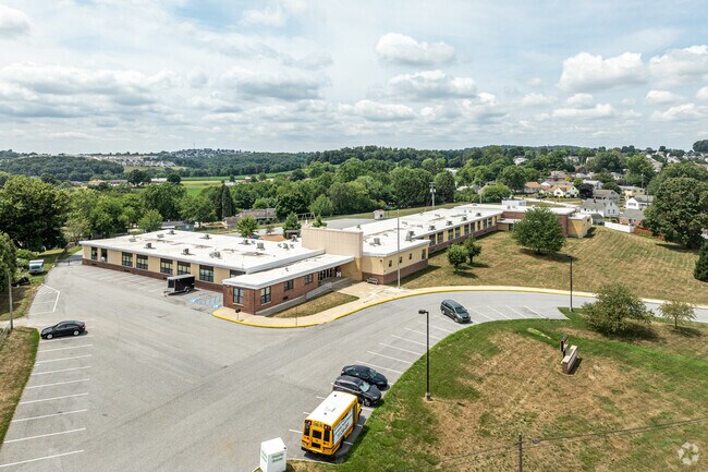 With hills in the background, Windsor Manor Elementary School is set in a suburban community.