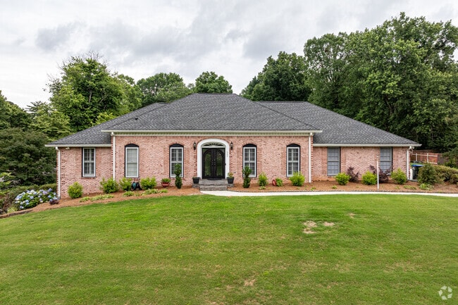Oversized single-story homes sit on spacious lots with large front yards in Saddle Creek.