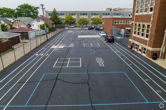 Columbus East Elementary School features a paved play area.