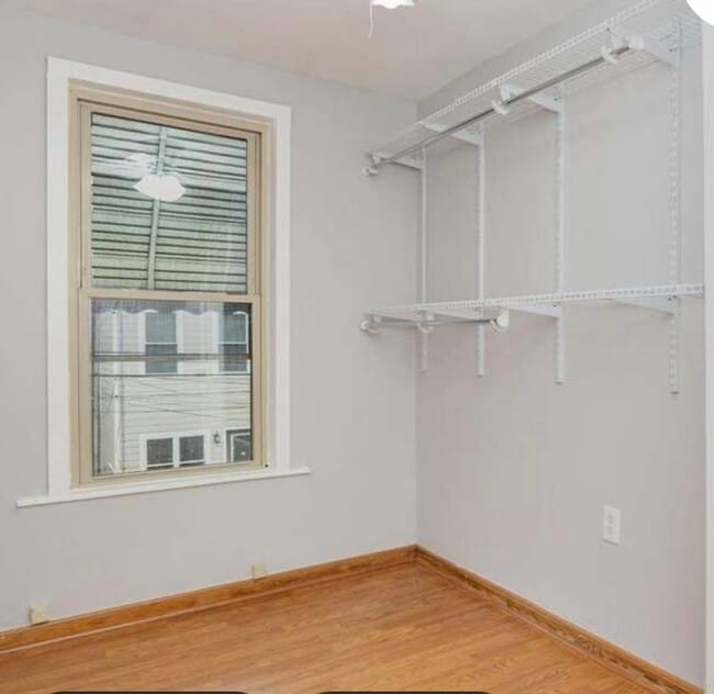 2nd small BR - shelves installed for walk in closet