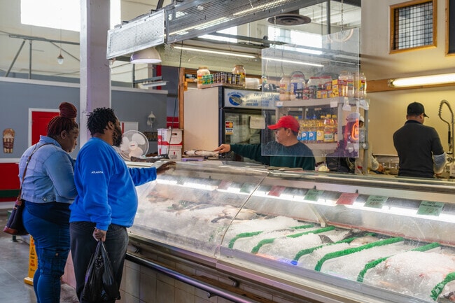Nearby, Municipal Market hosts vendors selling fresh fish and other consumables.