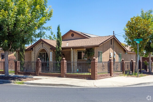 An older home with stone arch entry in Parlier.