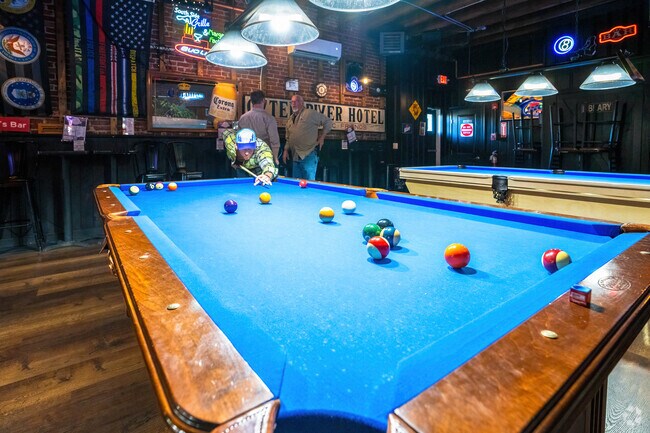 The Otter River Pub has a full bar with pool tables, darts and TVs for sports.