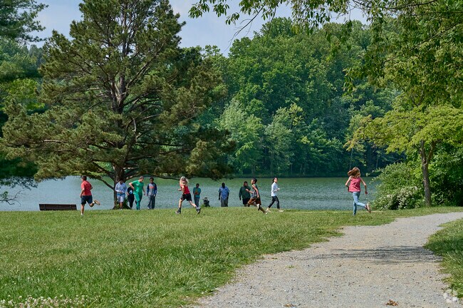 Children explore Clopper Lake at Seneca Creek State Park in Germantown.