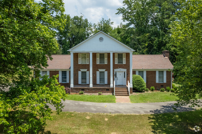 Large brick Greek revival style homes can be found throughout Grassy Creek.