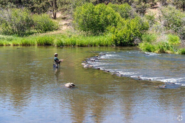 Fisherman can wade into the clear waters at Cline Falls State Park for  fly fishing in Redmond.