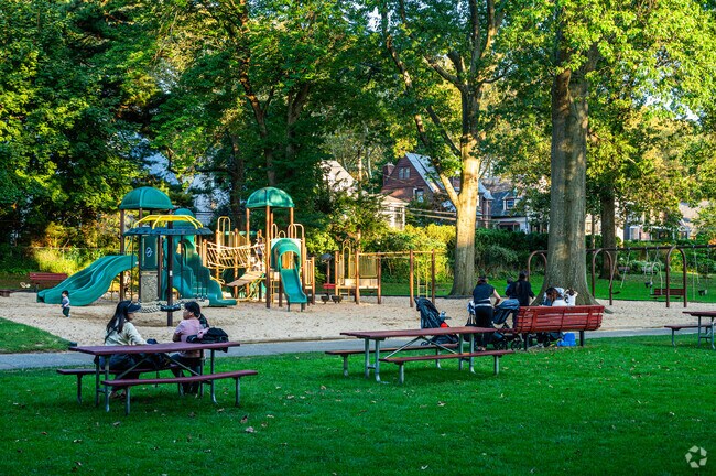 Relax with friends and family at Cutter Mill Park, featuring a shaded playground for all ages.