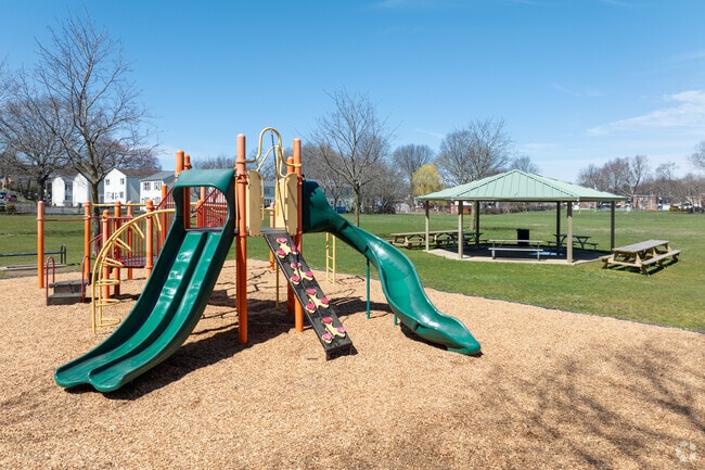 Visitors enjoy the new playground equipment at Success Park in Boston Ave-Mill Hill.