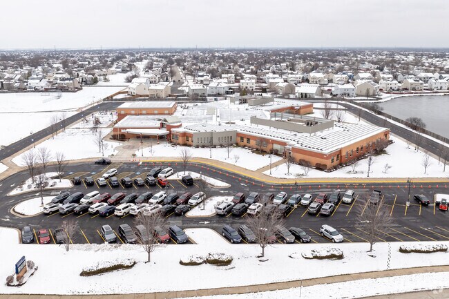 Troy Hofer Elementary School has a large parking lot.