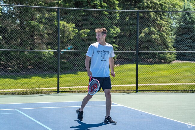 Play a tennis match with some friends at Ashbury Park.
