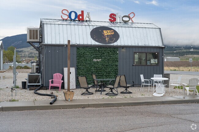 Enoch has a few restaurants and specialty shops, like the Soda Shop offering a variety of sodas and snacks, plus a patio and cornhole.