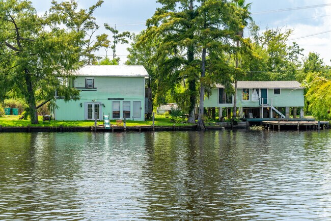 Discover peaceful lakeside retreat in Moss Bluff with scenic views and private lake access.