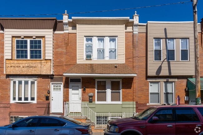 Brick rowhomes and some more modern siding can be seen in Hunting Park.