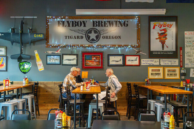 FlyBoy Brewery and Pub serves stone-fired pizzas in an aerospace-themed interior.
