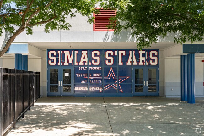 Large murals at the entrance of Joseph M. Simas Elementary School welcomes students.