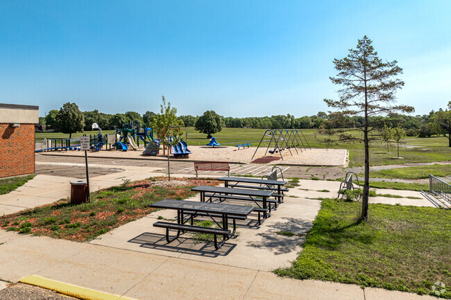 Hoover Elementary School features picnic tables and a playground.