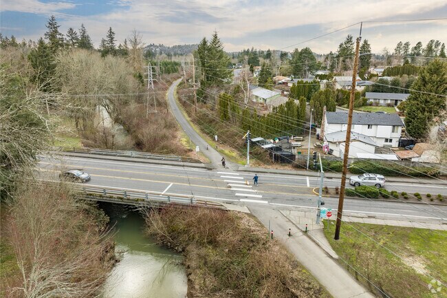 Pedestrian enjoy the crossing on the Springwater Corridor Trail along Johnson Creek.