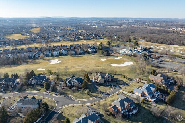 Many homes in the gated parts of Belmont wind through an 18 hole golf course.