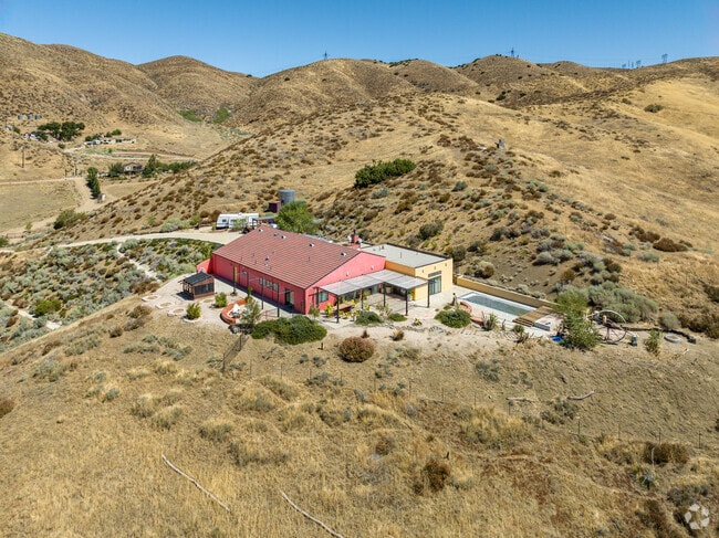 A contemporary home sits on a hilltop in Leona Valley.
