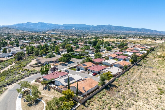An aerial vista of Phelan highlights a combination of newly constructed and farm-style homes.