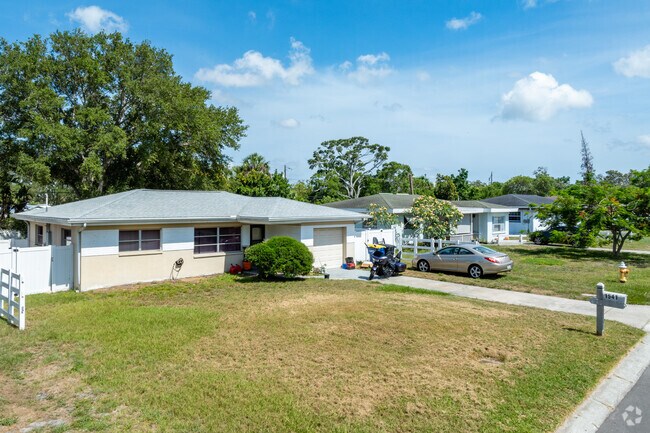 Lots in Brookhill are larger grassy lawns with scattered mature oaks, palms and other trees.