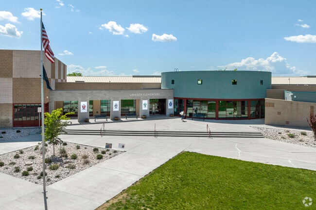 A well planned entry at Lakeside Elementary School in West Point has a green lawn, American flag and lots of sidewalk space.