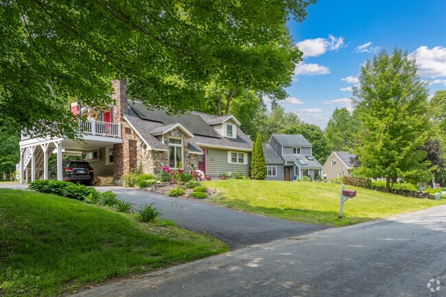 Colonial homes in Ashford feature beautiful, spacious yards surrounded by serene green spaces.