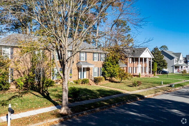 Tree-lined streets frame charming homes in Camellia Shores.