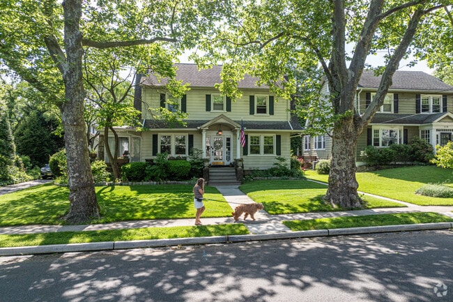 Shaded streets provide a comfortable walking experience through Merchantville.