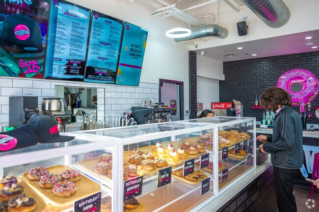 Enjoy fresh pastries at Outcast Doughnuts just a mile away from Evergreen Historic District.