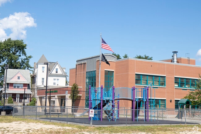 A wide shot of entire school with playground
