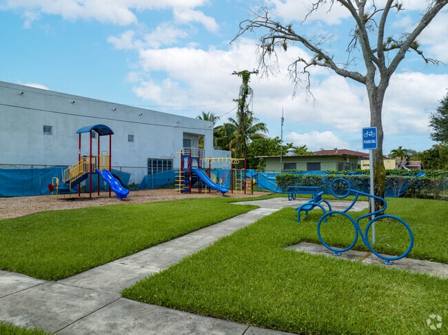 The tot lot in Breezeswept Estates features ample playground equipment and structures for children to enjoy.