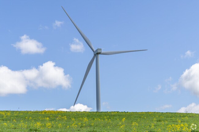 There are dozens of windmills in the hills surrounding Villenova creating clean energy for the whole county.