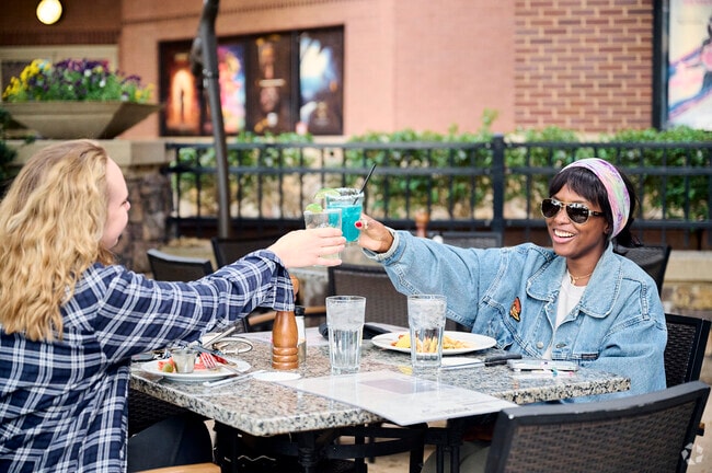 Residents of Hartland enjoy the outdoor seating at Blue Ridge Grill on a nice sunny day.