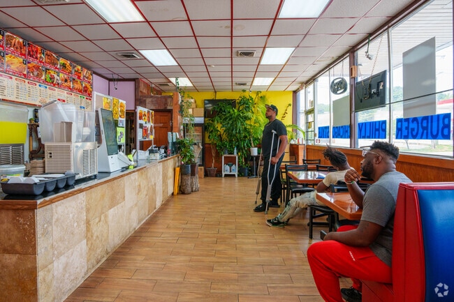 Residents of Campbellton Road wait patiently for their orders from G Town Wing and Fish.