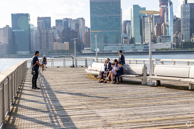 Families enjoy special moments along the East River at Hunter's Point.