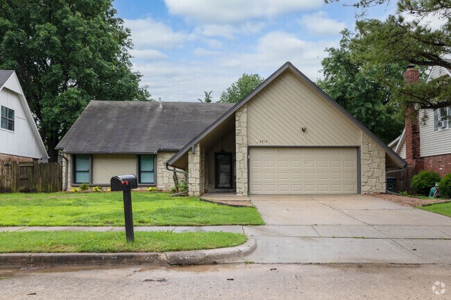 Stone veneer ranch-style homes are prevalent throughout Wolf Creek Estates.