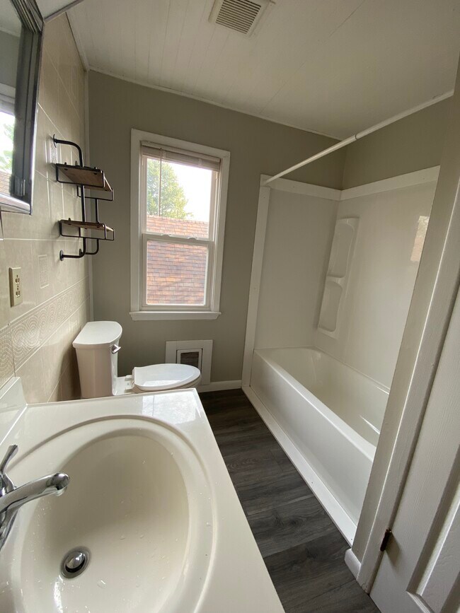 Full bathroom with linen closet