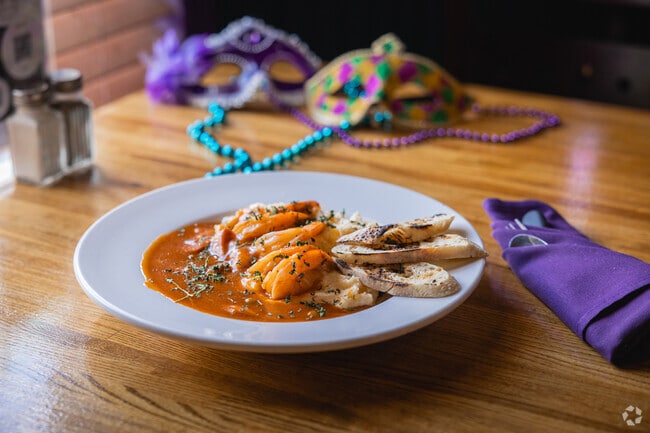 Enjoy shrimp & grits alongside many tasty menu options at Haletown's Succotash.