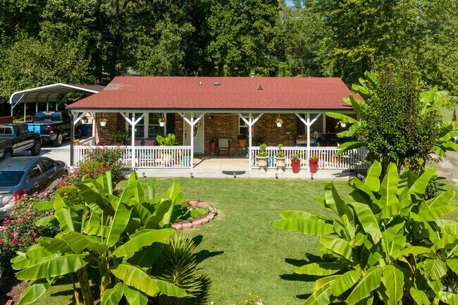 Summit Hills homes often feature leafy yards and brick exteriors.