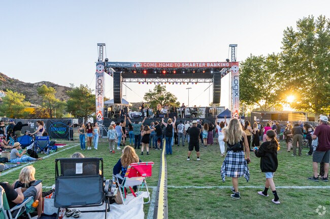 Guests are hyped up as the performance begins at the Concerts in the Park.