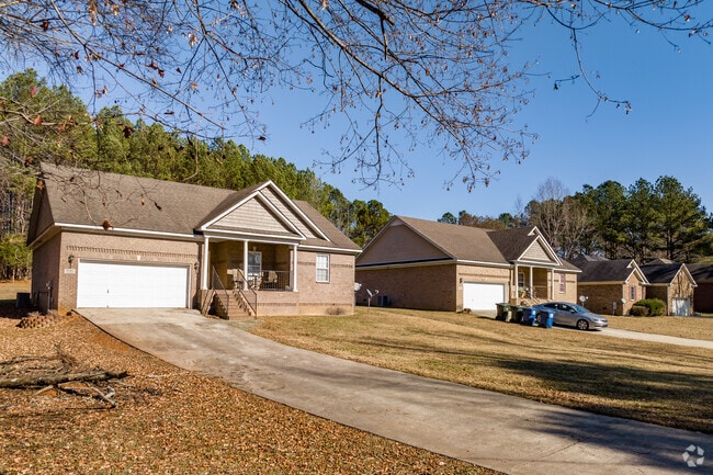A row of brick homes with small front porches in Ready Crossing.